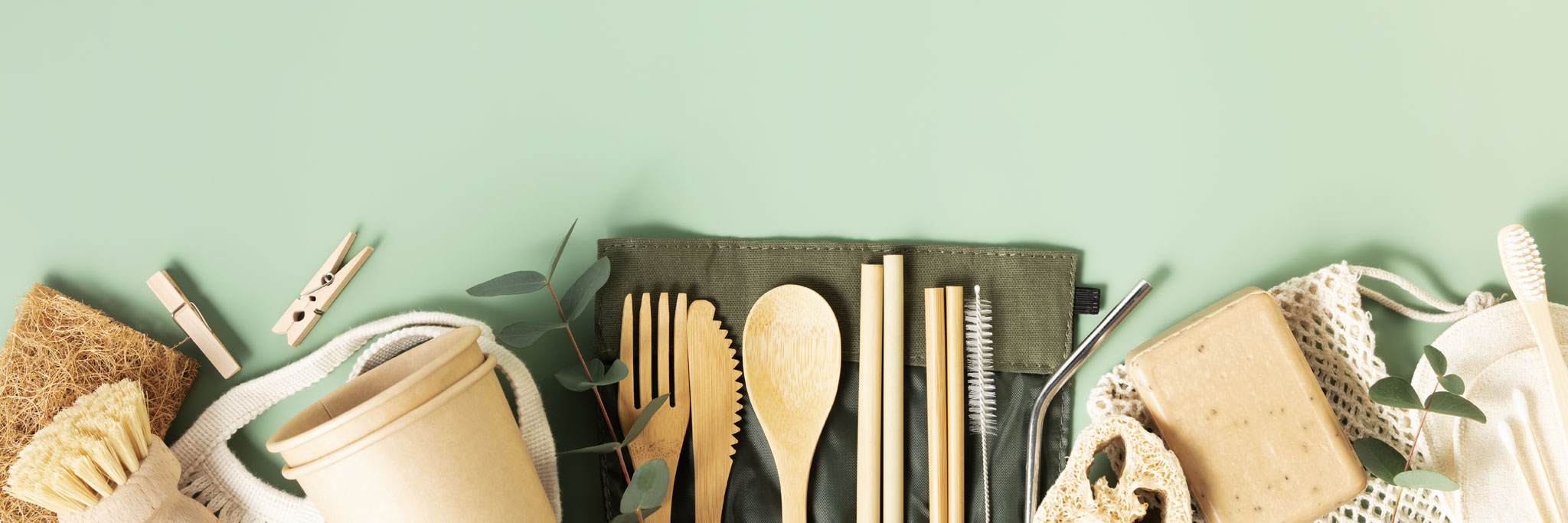 bamboo products laid across green background