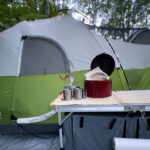 camping tent with a table in the foreground