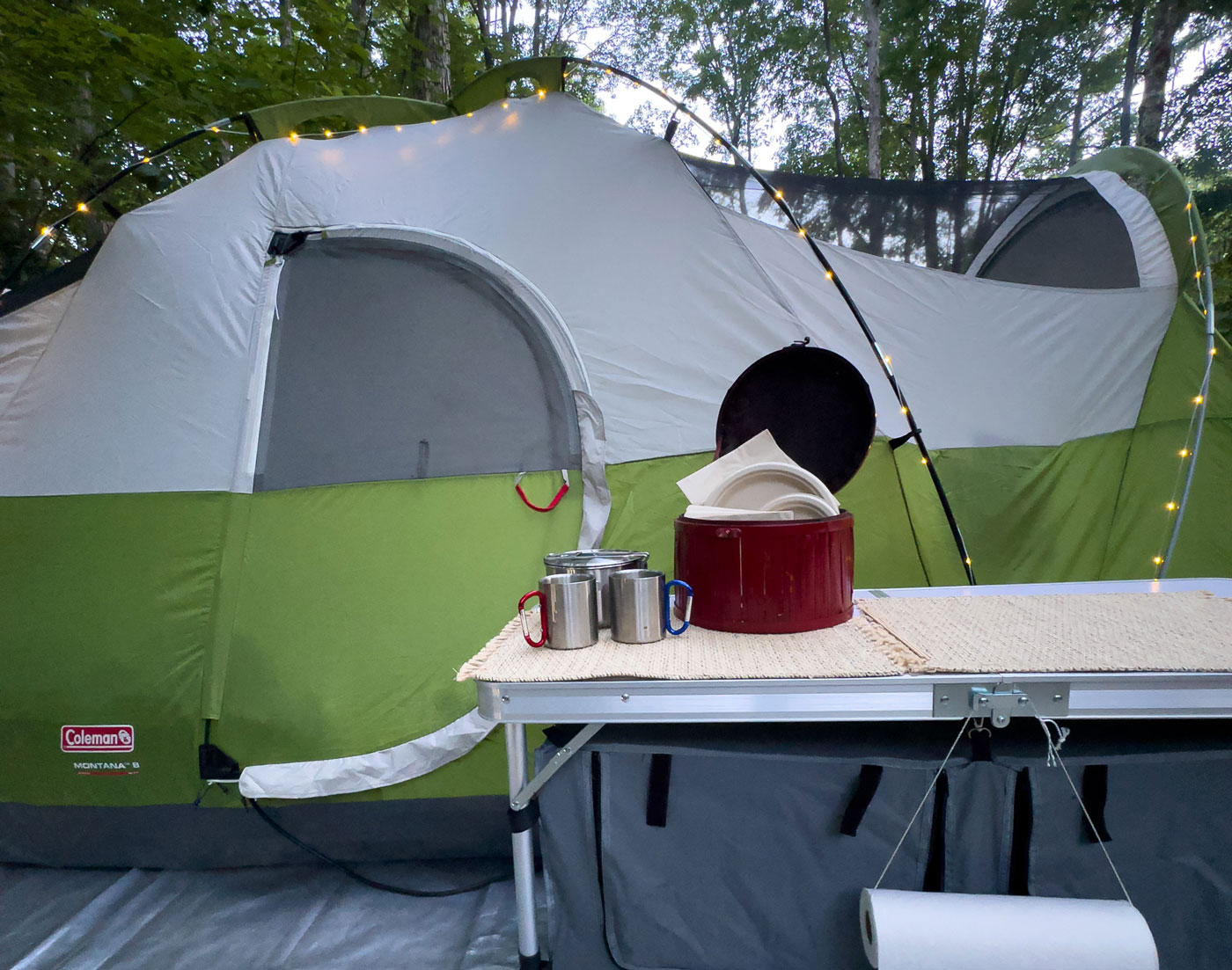 camping tent with a table in the foreground